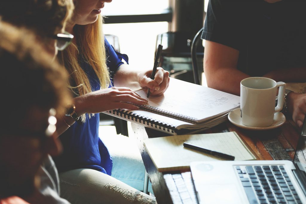 Startup Stock Photos two people and a notebook